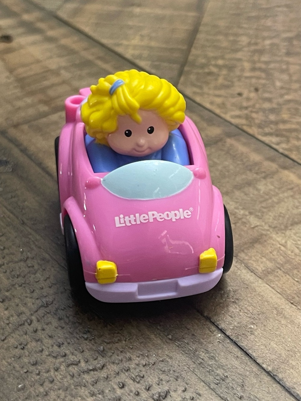 Fisher-Price Little People Wheelies Sarah Lynn figure in a pink convertible car